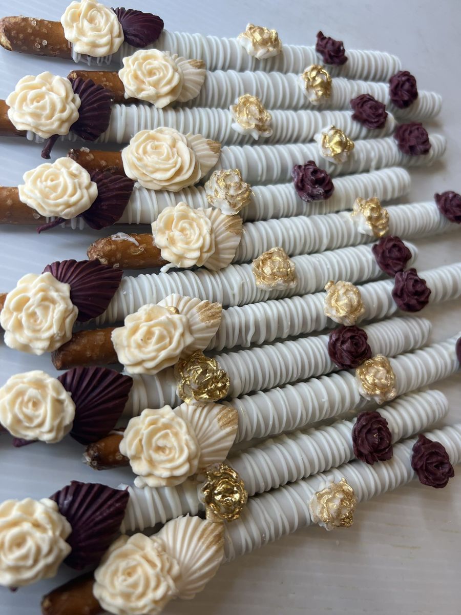 Chocolate dipped pretzel rods with roses
